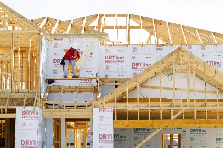 A worker on a new home under construction